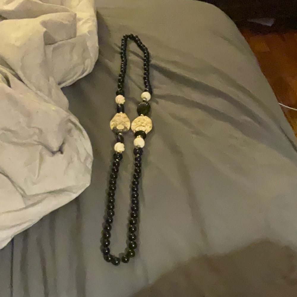 A long black and white necklace